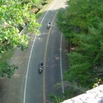 Photo - two motorcycles passing beneath Backbone Rock, TN